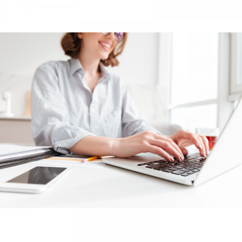 Teacher on laptop smiling